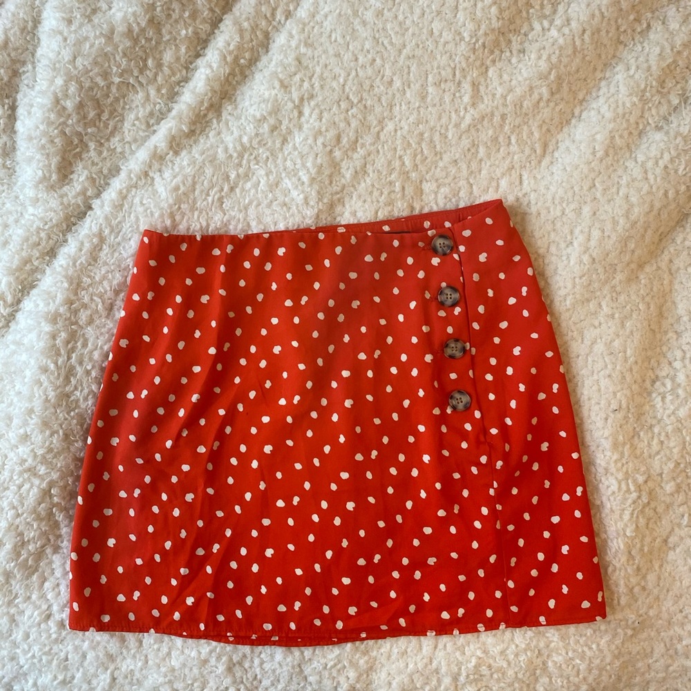 Lulu’s Red/orange Polka Dot Side-button skirt.